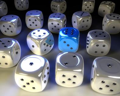 Multiple white glossy dice with one blue dice to show leadership stock photo