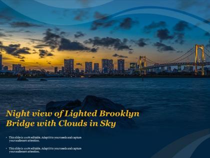 Night view of lighted brooklyn bridge with clouds in sky