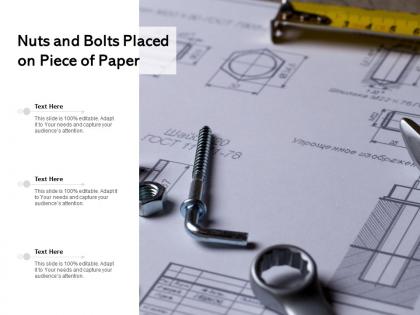 Nuts and bolts placed on piece of paper