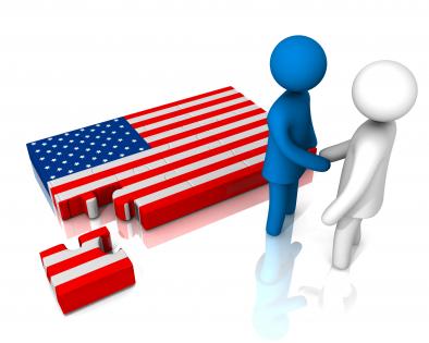 People shaking hands with us flag for business collaboration stock photo