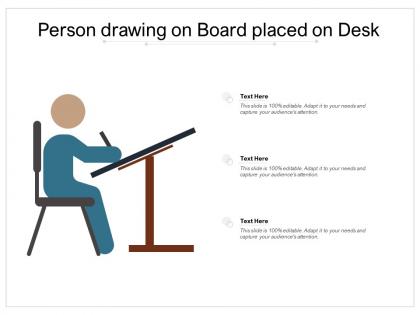 Person drawing on board placed on desk