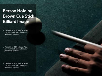 Person holding brown cue stick billiard image