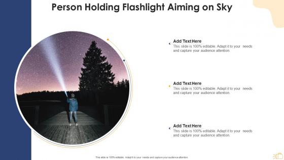 Person holding flashlight aiming on sky