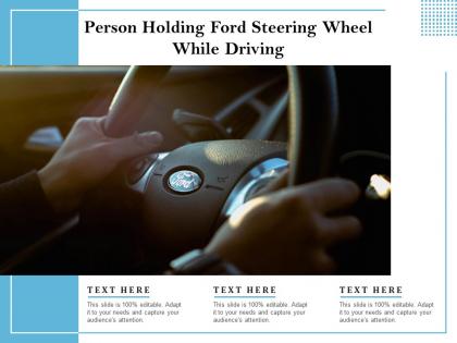 Person holding ford steering wheel while driving