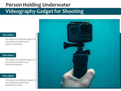 Person holding underwater videography gadget for shooting