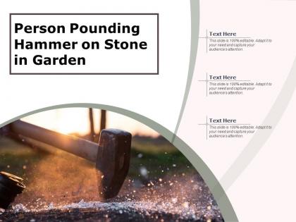 Person pounding hammer on stone in garden