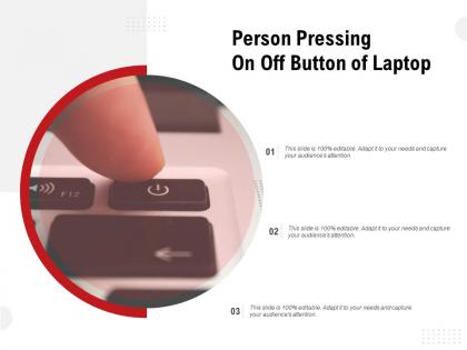 Person pressing on off button of laptop
