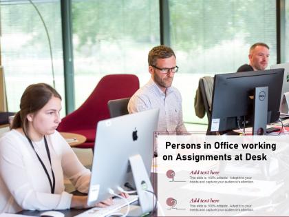 Persons in office working on assignments at desk
