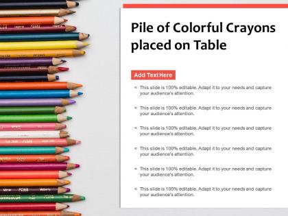 Pile of colorful crayons placed on table