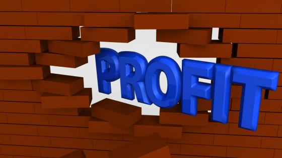 Profit word coming out from wall stock photo