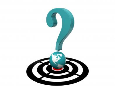 Question mark on target dartboard with globe showing global questions stock photo
