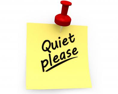 Quiet please text on sticky note stock photo