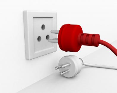 Red and white plugs with socket showing teamwork stock photo