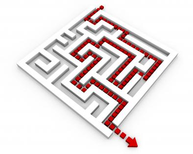 Red arrow showing solution path inside the maze stock photo