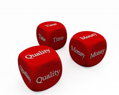 Red cubes of with time money and quality terms stock photo