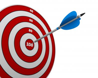 Red dartboard and arrow to show success target stock photo