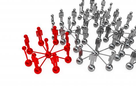 Red network leading grey network for leadership stock photo