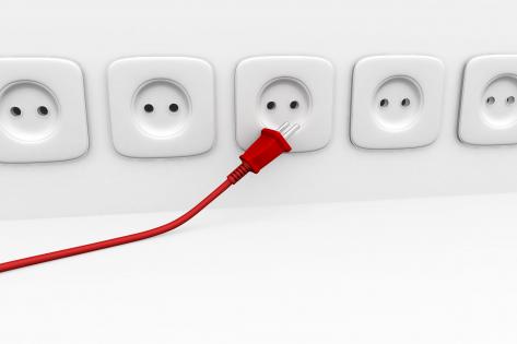 Red plug with multiple white plugs to show options available in business stock photo