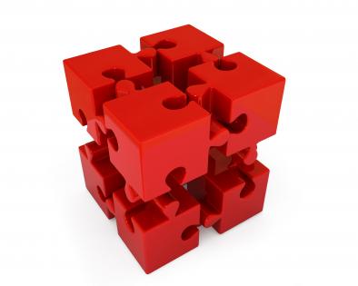 Red puzzle cube for business and leadership stock photo