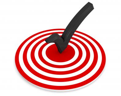 Red target dart with tick mark in middle stock photo