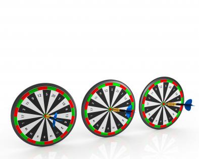 Row of dart boards isolated on white background stock photo