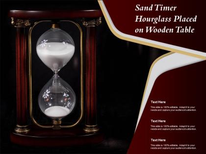 Sand timer hourglass placed on wooden table