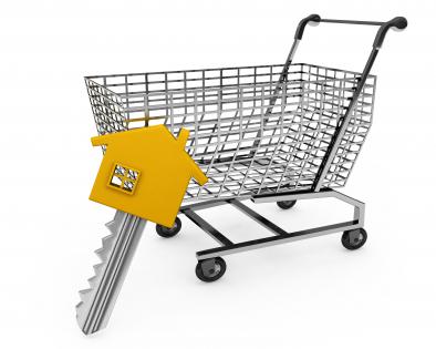 Shopping cart and key with house design head for real estate and marketing stock photo
