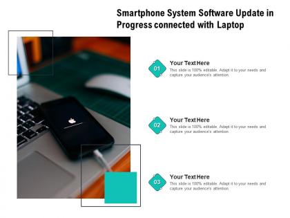 Smartphone system software update in progress connected with laptop