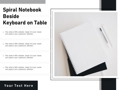 Spiral notebook beside keyboard on table
