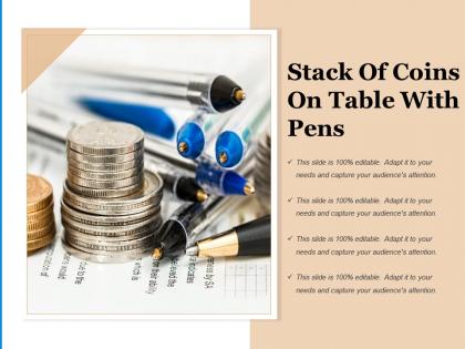 Stack of coins on table with pens