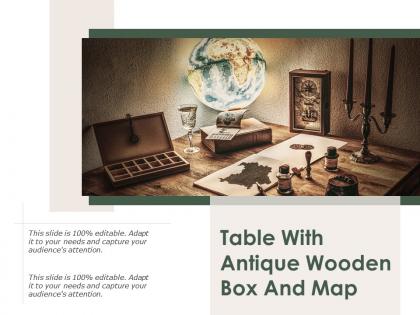 Table with antique wooden box and map