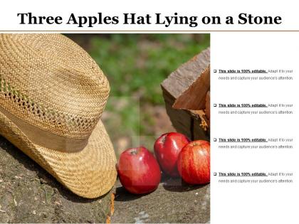 Three apples hat lying on a stone