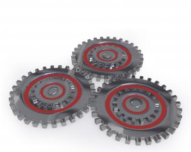 Three gears working together showing concept of teamwork stock photo