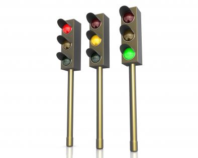 Three traffic lights with red green and yellow signals stock photo