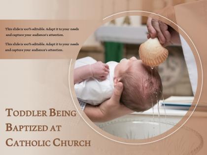 Toddler being baptized at catholic church