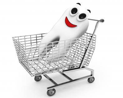 Tooth in shopping cart stock photo
