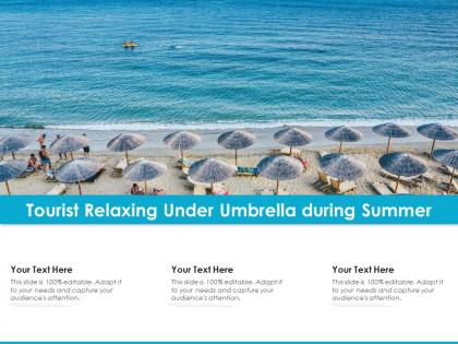 Tourist relaxing under umbrella during summer