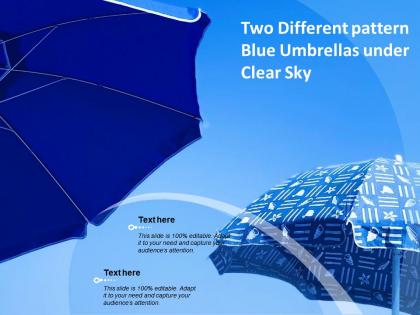 Two different pattern blue umbrellas under clear sky