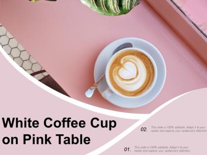 White coffee cup on pink table