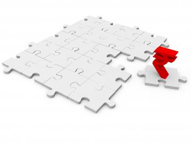White puzzle pieces and one puzzle part with rupee symbol stock photo