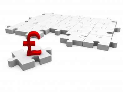 White puzzle pieces with pound on single puzzle showing finance stock photo