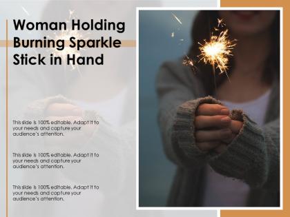 Woman holding burning sparkle stick in hand