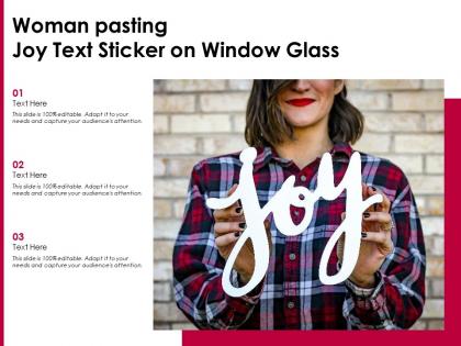 Woman pasting joy text sticker on window glass