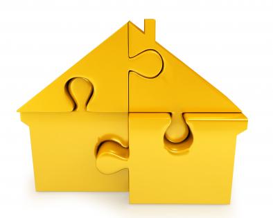 Yellow colored puzzle with hut shape stock photo