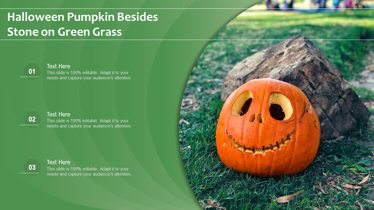 Halloween Pumpkin Besides Stone on Green Grass